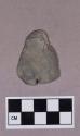 Ground stone, modified lithic, thin triangular stone with notched edges