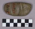 Ground stone, atlatl weight, grooved, mended with 79-42-10/19128.2