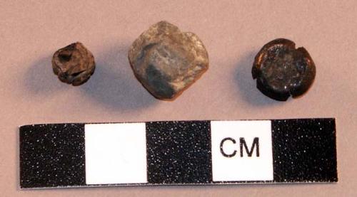 Miscellaneous objects, 1 rock, 1 seed, 1 copper bell clapper.