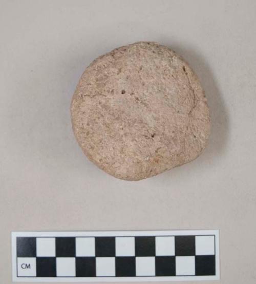 Stucco disk; part of ornament or figure