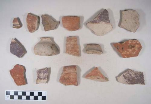 Earthenware vessel sherds of various forms; some with red paint decoration, some with polychrome decoration