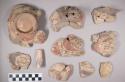 Earthenware vessel sherds with various painted decoration; some body, rim, and handle sherds