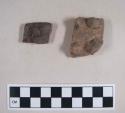 2 unpainted body potsherds with applique