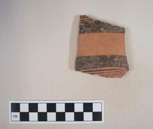 Earthenware body sherd with polychrome painted decoration