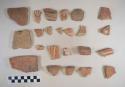 Earthenware sherds; some body, some rim; some red paint decoration, some poly-chrome, some incised, one pale paste and white paint; two pieces of plaster; one natural pebble