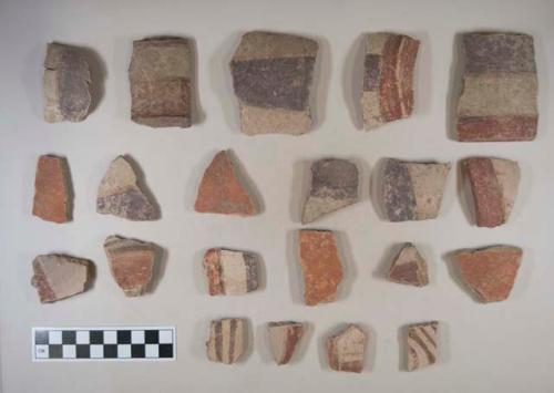 Earthenware vessel rim, body, and base sherds with polychrome decoration; some with red exterior decoration only.