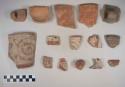 Earthenware vessel sherds with various painted decoration; some body, rim, and handle sherds