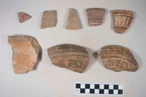 Earthenware vessel sherds; most decorated in polychrome paint designs, some unpainted buff; rim, base, and body sherds