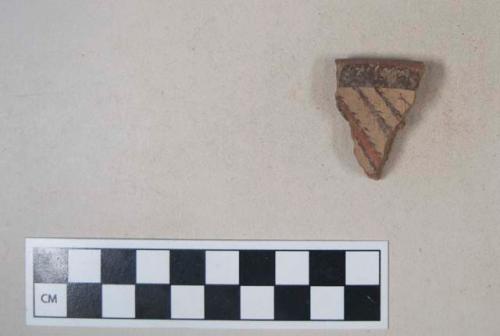 Earthenware vessel body sherd with polychrome painted decoration