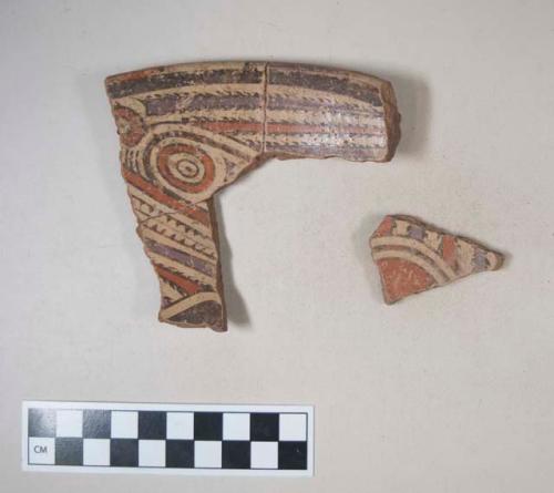 Earthenware vessel rim and body sherds with polychrome decoration; the largest being three previously crossmended fragments