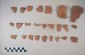 Earthenware vessel sherds; red painted interior and exterior; rim, body, and base sherds.