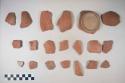 Earthenware vessel sherds red on buff decoration exterior; Rim, body, and base sherd.