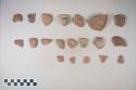 Earthenware vessel sherds with polychrome decoration, some with red on buff; some, body, base, rim sherds and one loop handle sherd.
