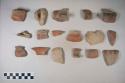 Earthenware vessel sherds with red on buff decoration; rim, body, loop handle sherds