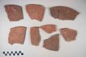 Earthenware plate sherds with decoration, Some red paint interior, some red on buff interior and exterior, some red paint interior and exterior, some white paint exterior; rim, base, and body sherds, Some with charring.