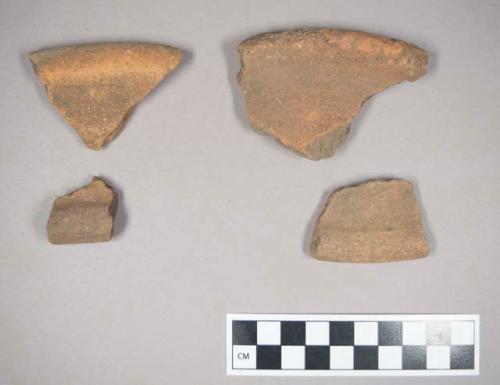 14 rim potsherds from fairly heavy vessels with rolled lips