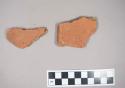 2 rim and one body sherds of hard orange gritty ware