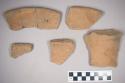 5 rim potsherds of hard gritty, rather thick ware