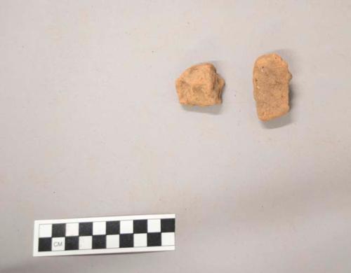 2 pottery briquette fragments