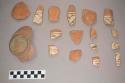 Earthenware vessel body ,rim and base sherds. Most with poly chrome painted designs. Some with just red paint decoration.