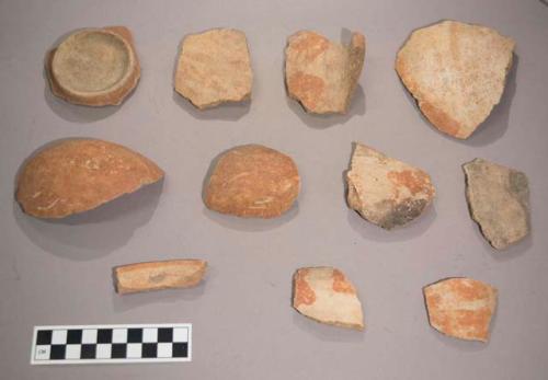 Earthenware vessel rim, body and base sherds. Most red on white painted decoration. Some polychrome decorated. Foot ring base sherd, Some flared rim sherds.