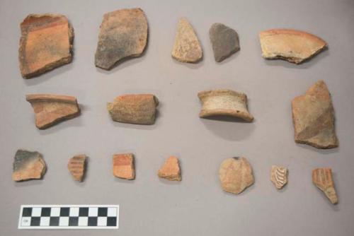 Earthenware vessel base, body, and rim sherds. Most with red paint decoration. Some with polychrome decoration.