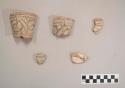 Earthenware vessel rim and body sherds decorated with polychrome designs. Most are likely jar necks.