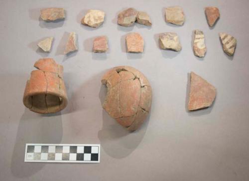 Earthenware vessel rim and body sherds. Most with polychrome decoration, some with red paint exterior and undecorated interior.