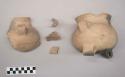 Earthenware vessel rim, body, and  strap handle sherds. Some with red painted interior and exterior.Some appear undecorated. Some with polychrome decoration.