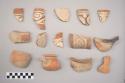 Earthenware vessel rim, body sherds. Some with red painted exterior, some with white painted exterior, some with red on white decoration, Some decorated in polychrome designs. Some with charring.