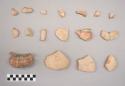 Earthenware vessel flared rim and body sherds. Some with white paint exterior, some with red on white paint exterior.