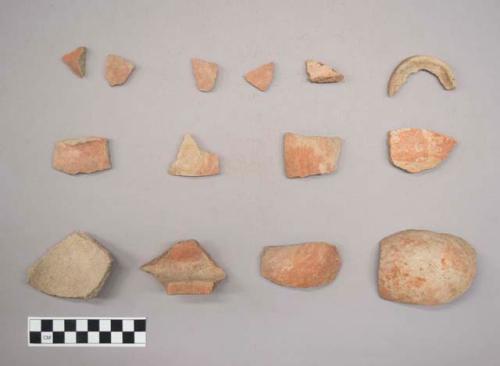 Earthenware vessel rim, body, and foot ring base sherds. Most with red painted exterior. Some with red on white decoration.