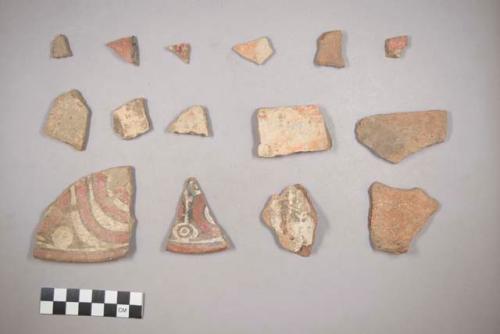 Earthenware vessel body sherds. Some with polychrome interior designs. Some with white painted exterior and one with red painted interior.