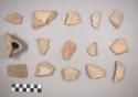 Earthenware vessel rim and body sherds. Some with red on buff paint, some with red on white paint. Some with polychrome  designs on exterior. Some undecorated.