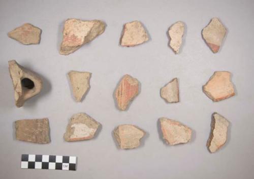 Earthenware vessel rim and body sherds. Some with red on buff paint, some with red on white paint. Some with polychrome  designs on exterior. Some undecorated.