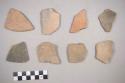Earthenware vessel body sherds. Some with incised decoration on exterior. Some with cordmarked exterior. Some with red paint decoration. Some charred.