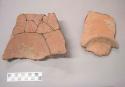 Earthenware vessel rim, body, and base sherds. Red paint interior and exterior. Foot ring base. Object was a plate shaped vessel. Object was reassembled and glued; since that point some of the glued fragements have become unglued. Some fragments have different object numbers.