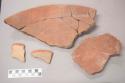 Earthenware vessel rim, body, and foot ring base sherds. Most with red painted interior and undecorated interior. Some with red painted interior and exterior.