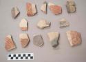 Earthenware vessel rim and body sherds. Polychrome (red, purple, gold, and white) painted exterior. Most with unpainted interior. Some interior portions with incised or impressed lines.