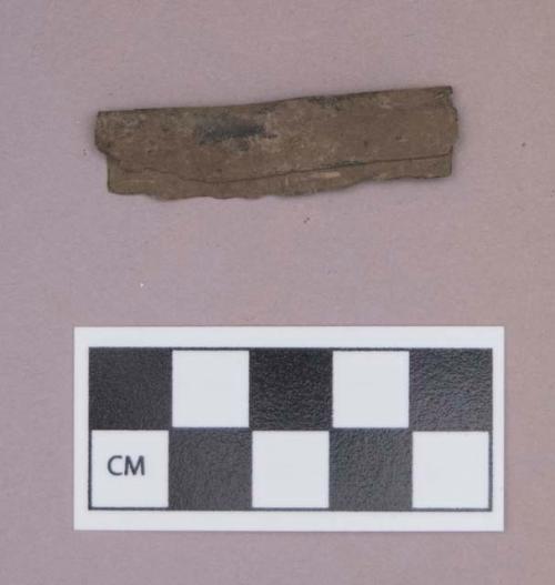 Metal, copper alloy sheet fragment, folded