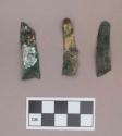 Metal, copper alloy sheet fragments, worked, one with mica adhered to it
