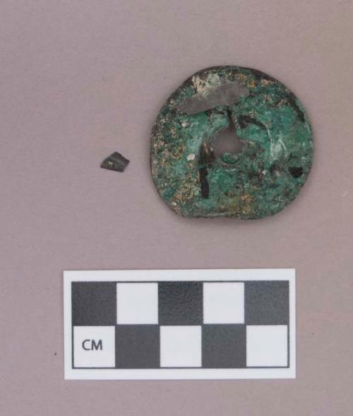 Metal, copper alloy ear spool fragment