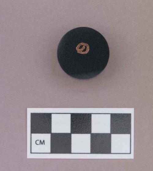 Metal, copper alloy tube fragment, embedded in plastic or resin disk