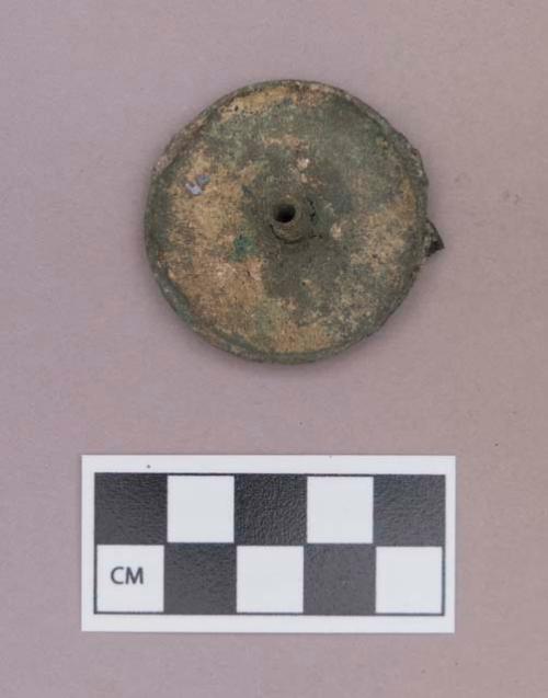 Metal, copper alloy ear spool fragment