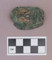 Metal, copper alloy ear spool fragment