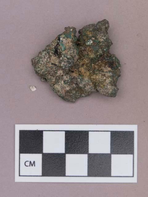 Metal, copper alloy fragment, flat on one side, possibly natural