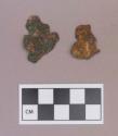 Metal, copper alloy sheet fragments, worked, one perforated