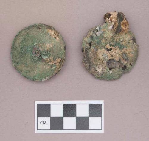 Metal, copper alloy ear spool fragments, with shells, worked animal bone beads, and iron fragments adhered to the surface