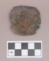 Metal, copper alloy ear spool fragment, possibly silver plated