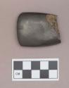 Polished hematite edged tool fragment, adze or axe